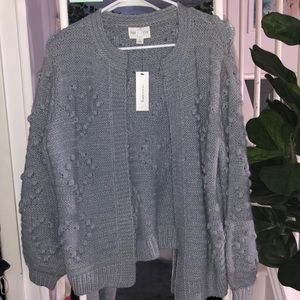 grey cardigan with heart details all over